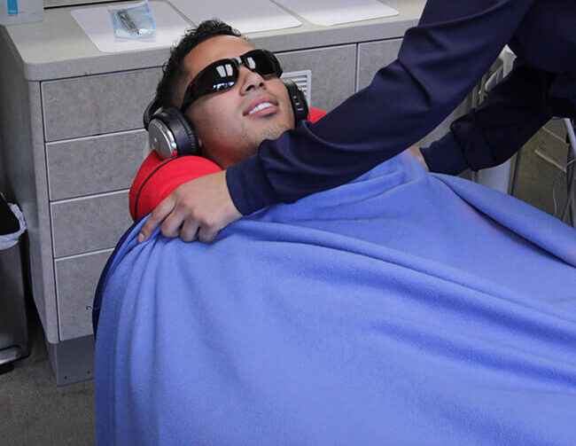 Male-patient-sitting-dental-chair Is All-on-X right for you