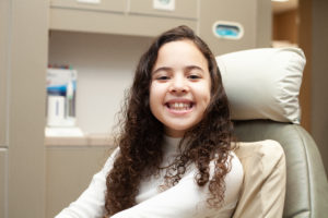 Girl smiling in dental chair